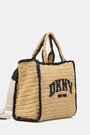 Woven raffia DKNY tote in natural beige with black details and bold logo, spacious and structured with dual handles and shoulder strap — ψάθινη DKNY τσάντα σε φυσική απόχρωση με μαύρες λεπτομέρειες και λογότυπο, ευρύχωρη και κομψή, ιδανική για summer city looks και resort styling με minimal χαρακτήρα. Διαθέσιμη στο Iconic Angels Glyfada.