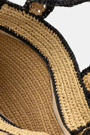 Woven raffia DKNY tote in natural beige with black details and bold logo, spacious and structured with dual handles and shoulder strap — ψάθινη DKNY τσάντα σε φυσική απόχρωση με μαύρες λεπτομέρειες και λογότυπο, ευρύχωρη και κομψή, ιδανική για summer city looks και resort styling με minimal χαρακτήρα. Διαθέσιμη στο Iconic Angels Glyfada.