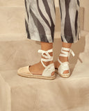 Women’s beige suede flat espadrille sandals with ankle wrap ties and jute sole, γυναικεία flat εσπαντρίγια από suede δέρμα σε φυσική μπεζ απόχρωση με κορδέλες που δένουν στον αστράγαλο και σχοινένια σόλα, καλοκαιρινή κομψή επιλογή, από το Iconic Angels Glyfada.