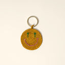 Handwoven smile keychain in raffia with playful character and summery feel, the perfect little accessory to elevate your everyday essentials — πλεκτό μπρελόκ χαμόγελο από raffia με παιχνιδιάρικο design και καλοκαιρινή διάθεση, ιδανικό για να δώσει χαρακτήρα στα κλειδιά ή την τσάντα σας. Διαθέσιμο στο Iconic Angels Glyfada.