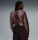 Leopard print zip-up track jacket with black contrast sleeves and subtle Puma logo detail, blending retro sport heritage with bold statement style — γυναικείο track jacket με animal print μοτίβο και φερμουάρ, ιδανικό για athleisure, street style και trend-forward looks με δυναμικό χαρακτήρα. Διαθέσιμο στο Iconic Angels Glyfada.