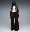 Leopard print zip-up track jacket with black contrast sleeves and subtle Puma logo detail, blending retro sport heritage with bold statement style — γυναικείο track jacket με animal print μοτίβο και φερμουάρ, ιδανικό για athleisure, street style και trend-forward looks με δυναμικό χαρακτήρα. Διαθέσιμο στο Iconic Angels Glyfada.