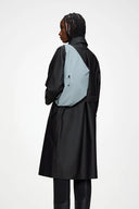 Minimal light blue bum bag with sleek silhouette, lightweight and water-resistant, perfect for hands-free city styling — minimal γαλάζιο bum bag με καθαρές γραμμές, ανάλαφρο και αδιάβροχο, ιδανικό για urban εμφανίσεις με άνεση όλη μέρα. Διαθέσιμο στο Iconic Angels Glyfada.
