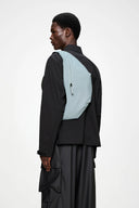 Minimal light blue bum bag with sleek silhouette, lightweight and water-resistant, perfect for hands-free city styling — minimal γαλάζιο bum bag με καθαρές γραμμές, ανάλαφρο και αδιάβροχο, ιδανικό για urban εμφανίσεις με άνεση όλη μέρα. Διαθέσιμο στο Iconic Angels Glyfada.