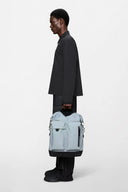 Light grey waterproof backpack with structured silhouette and utility front pockets, clean and contemporary for everyday city moves — ανοιχτό γκρι αδιάβροχο backpack με δομημένη γραμμή και πρακτικές μπροστινές θήκες, minimal και σύγχρονο για δυναμικά καθημερινά looks στην πόλη. Διαθέσιμο στο Iconic Angels Glyfada.