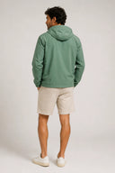 Lightweight green hooded jacket with clean lines and water-resistant finish — ανάλαφρο πράσινο jacket με κουκούλα, minimal αισθητική και αδιάβροχη υφή για προστασία με urban χαρακτήρα. Ιδανικό για layering και effortless street looks, από το πρωινό commute μέχρι τις βραδινές εξόδους. Διαθέσιμο στο Iconic Angels Glyfada.