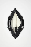 Cream waterproof tote bag with contrast black straps, structured and spacious, perfect for city days and weekend escapes — κρεμ αδιάβροχη tote τσάντα με μαύρα λουριά σε αντίθεση, minimal και ευρύχωρη, ιδανική για busy καθημερινότητα αλλά και σύντομες αποδράσεις. Διαθέσιμη στο Iconic Angels Glyfada.
