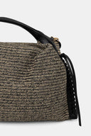 DKNY Jeans woven hobo handbag in natural and black raffia-style texture with black leather top handle and decorative bead charm, featuring a structured silhouette for stylish summer everyday looks — γυναικεία DKNY Jeans woven hobo τσάντα σε natural και μαύρη ψάθινη υφή με μαύρη δερμάτινη λαβή και διακοσμητικό charm, ιδανική για κομψά καλοκαιρινά looks.