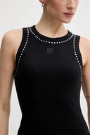 Sleek sleeveless midi dress in timeless black with subtle crystal details along the neckline — εφαρμοστό DKNY φόρεμα με minimal γραμμή που αγκαλιάζει το σώμα και διακριτική λάμψη στους ώμους. Απόλυτα elegant για βραδινές εμφανίσεις αλλά και elevated city looks. Διαθέσιμο στο Iconic Angels Glyfada.