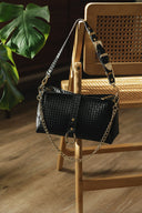 Individual Art Leather Mexican Moon τσάντα σε μαύρο πλεκτό δέρμα με χρυσές λεπτομέρειες και statement αγκράφα, με structured σχήμα και αποσπώμενο λουράκι, ιδανική για elegant και modern καθημερινά looks — γυναικεία leather shoulder bag.