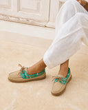 Manebi women’s beige suede boat shoes with green bandana print detail and classic lace-up design, combining nautical inspiration with relaxed Mediterranean summer style for elegant casual outfits — γυναικεία μπεζ suede boat shoes Manebi με πράσινη bandana λεπτομέρεια και κορδόνια, εμπνευσμένα από nautical αισθητική για κομψά καλοκαιρινά casual looks. Διαθέσιμα στο Iconic Angels Glyfada.
