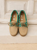 Manebi women’s beige suede boat shoes with green bandana print detail and classic lace-up design, combining nautical inspiration with relaxed Mediterranean summer style for elegant casual outfits — γυναικεία μπεζ suede boat shoes Manebi με πράσινη bandana λεπτομέρεια και κορδόνια, εμπνευσμένα από nautical αισθητική για κομψά καλοκαιρινά casual looks. Διαθέσιμα στο Iconic Angels Glyfada.