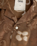 OAS Memento Brillo brown long sleeve shirt with tonal jacquard abstract pattern and relaxed silhouette, featuring a soft textured fabric and button-up front for elevated casual styling — καφέ μακρυμάνικο πουκάμισο OAS Memento Brillo με tonal jacquard abstract μοτίβο και χαλαρή γραμμή, με απαλή textured ύφανση και κουμπιά μπροστά για elevated casual εμφανίσεις.