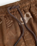 OAS Memento brown jacquard shorts with tonal abstract pattern and relaxed fit, featuring an elasticated waistband with drawstring and textured fabric for elevated summer styling — ανδρικό OAS Memento καφέ jacquard σορτς με tonal abstract μοτίβο και χαλαρή γραμμή, με λάστιχο στη μέση και κορδόνι και textured ύφασμα για elevated καλοκαιρινά looks.