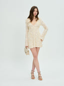 Project Soma cream mini dress with textured fringe and sequin detailing, featuring a deep V-neckline, long sleeves and fitted silhouette for statement evening and party looks — γυναικείο Project Soma κρεμ mini φόρεμα με κρόσσια και παγιέτες, βαθύ ντεκολτέ και μακριά μανίκια, ιδανικό για εντυπωσιακές βραδινές εμφανίσεις.