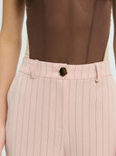 Project Soma pink pinstripe wide-leg trousers with high-waisted fit and tailored silhouette, featuring subtle vertical stripes and clean lines for elegant everyday and office styling — γυναικείο Project Soma ροζ ριγέ παντελόνι σε wide-leg γραμμή με ψηλόμεση εφαρμογή και διακριτικές κάθετες ρίγες, ιδανικό για κομψά καθημερινά και office looks.