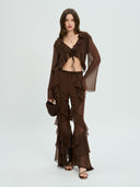 Project Soma brown sheer ruffle crop top with lightweight chiffon fabric and cascading frill detailing, featuring a deep V neckline, tie-front closure and flared sleeves for bold coordinated and evening looks — γυναικείο Project Soma καφέ διάφανο crop top με βολάν και chiffon υφή, με βαθύ ντεκολτέ, δέσιμο μπροστά και καμπάνα μανίκια για εντυπωσιακά σύνολα.
