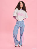 White oversized Barbie logo T-shirt from Project Soma x Barbie collection with pink graphic print for playful casual styling — λευκό γυναικείο oversized t-shirt Project Soma x Barbie με ροζ Barbie logo print για μοντέρνα casual looks. Διαθέσιμο στο Iconic Angels Glyfada.