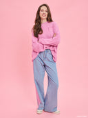 Pink oversized knit sweater from Project Soma x Barbie collection with embroidered Barbie logo and relaxed silhouette for cozy stylish looks — ροζ πλεκτό oversized γυναικείο πουλόβερ Project Soma x Barbie με κεντημένο Barbie logo και άνετη γραμμή για μοντέρνα casual looks. Διαθέσιμο στο Iconic Angels Glyfada.