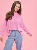 Pink oversized knit sweater from Project Soma x Barbie collection with embroidered Barbie logo and relaxed silhouette for cozy stylish looks — ροζ πλεκτό oversized γυναικείο πουλόβερ Project Soma x Barbie με κεντημένο Barbie logo και άνετη γραμμή για μοντέρνα casual looks. Διαθέσιμο στο Iconic Angels Glyfada.