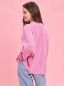 Pink oversized knit sweater from Project Soma x Barbie collection with embroidered Barbie logo and relaxed silhouette for cozy stylish looks — ροζ πλεκτό oversized γυναικείο πουλόβερ Project Soma x Barbie με κεντημένο Barbie logo και άνετη γραμμή για μοντέρνα casual looks. Διαθέσιμο στο Iconic Angels Glyfada.