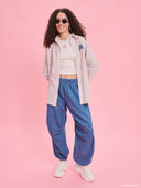 White ribbed sleeveless top from Project Soma x Barbie collection with pink embroidered logo and fitted silhouette for modern casual styling — λευκό ribbed γυναικείο αμάνικο top Project Soma x Barbie με ροζ κεντημένο logo και εφαρμοστή γραμμή για μοντέρνα casual looks. Διαθέσιμο στο Iconic Angels Glyfada.