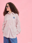 Striped oversized shirt from Project Soma x Barbie collection with pastel stripes and embroidered logo for playful contemporary styling — γυναικείο ριγέ oversized πουκάμισο από τη συλλογή Project Soma x Barbie με pastel ρίγες και κεντημένο logo για μοντέρνα playful looks. Διαθέσιμο στο Iconic Angels Glyfada.