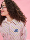 Striped oversized shirt from Project Soma x Barbie collection with pastel stripes and embroidered logo for playful contemporary styling — γυναικείο ριγέ oversized πουκάμισο από τη συλλογή Project Soma x Barbie με pastel ρίγες και κεντημένο logo για μοντέρνα playful looks. Διαθέσιμο στο Iconic Angels Glyfada.