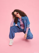 Blue denim balloon pants from Project Soma x Barbie collection with elastic waist and relaxed streetwear silhouette — γυναικείο denim παντελόνι balloon από τη συλλογή Project Soma x Barbie με λάστιχο στη μέση και χαλαρή streetwear γραμμή για statement casual looks. Διαθέσιμο στο Iconic Angels Glyfada.