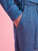 Blue denim balloon pants from Project Soma x Barbie collection with elastic waist and relaxed streetwear silhouette — γυναικείο denim παντελόνι balloon από τη συλλογή Project Soma x Barbie με λάστιχο στη μέση και χαλαρή streetwear γραμμή για statement casual looks. Διαθέσιμο στο Iconic Angels Glyfada.