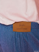 Blue denim balloon pants from Project Soma x Barbie collection with elastic waist and relaxed streetwear silhouette — γυναικείο denim παντελόνι balloon από τη συλλογή Project Soma x Barbie με λάστιχο στη μέση και χαλαρή streetwear γραμμή για statement casual looks. Διαθέσιμο στο Iconic Angels Glyfada.