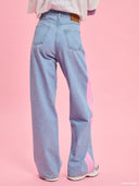 Light blue straight-leg jeans from Project Soma x Barbie collection with pink side stripe detail for modern sporty styling — γυναικείο τζιν Project Soma x Barbie σε ανοιχτό μπλε με ροζ πλαϊνή ρίγα και straight γραμμή για μοντέρνα casual looks. Διαθέσιμο στο Iconic Angels Glyfada.