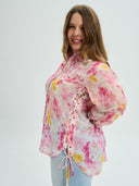Project Soma floral shirt in pink and yellow tones with lightweight sheer fabric, featuring button-up front, relaxed fit and side tie details for feminine statement styling — γυναικείο Project Soma floral πουκάμισο σε ροζ και κίτρινες αποχρώσεις με ανάλαφρη διάφανη υφή, με κουμπιά και πλαϊνά δεσίματα για εντυπωσιακά θηλυκά looks.
