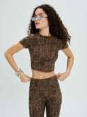 Project Soma brown cropped top with textured distressed-effect fabric and subtle shimmer detailing, featuring short sleeves, fitted silhouette and semi-sheer finish for edgy and statement evening looks — γυναικείο Project Soma καφέ cropped top με textured ύφανση και ελαφριά λάμψη, κοντό μανίκι και εφαρμοστή γραμμή για ιδιαίτερα βραδινά looks.