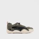 PUMA Mostro XC Vintage Fade sneakers in light green suede and mesh with futuristic spiked sole and sporty retro aesthetic — PUMA sneakers σε ανοιχτό χακί suede και mesh με ιδιαίτερη spiked σόλα και futuristic design, ιδανικά για elevated streetwear looks με bold χαρακτήρα. Διαθέσιμα στο Iconic Angels Glyfada.