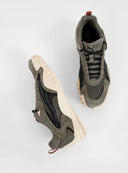 PUMA Mostro XC Vintage Fade sneakers in light green suede and mesh with futuristic spiked sole and sporty retro aesthetic — PUMA sneakers σε ανοιχτό χακί suede και mesh με ιδιαίτερη spiked σόλα και futuristic design, ιδανικά για elevated streetwear looks με bold χαρακτήρα. Διαθέσιμα στο Iconic Angels Glyfada.