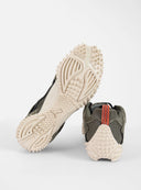 PUMA Mostro XC Vintage Fade sneakers in light green suede and mesh with futuristic spiked sole and sporty retro aesthetic — PUMA sneakers σε ανοιχτό χακί suede και mesh με ιδιαίτερη spiked σόλα και futuristic design, ιδανικά για elevated streetwear looks με bold χαρακτήρα. Διαθέσιμα στο Iconic Angels Glyfada.