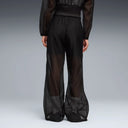 Black lightweight wide leg pants with semi-sheer fabric and elastic waistband, featuring subtle Puma logo detail for a modern sporty look — μαύρο γυναικείο παντελόνι σε wide leg γραμμή με ελαστική μέση και ελαφριά διαφάνεια, ιδανικό για athleisure, layering και chic sporty everyday looks. Διαθέσιμο στο Iconic Angels Glyfada.