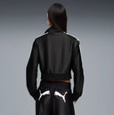 Black cropped track jacket with contrast white side stripes and bold Puma logo detail, combining retro sport heritage with modern streetwear appeal — μαύρο γυναικείο cropped track jacket με λευκές ρίγες στα μανίκια και statement logo μπροστά, ιδανικό για athleisure και street style looks με δυναμικό χαρακτήρα. Διαθέσιμο στο Iconic Angels Glyfada.