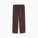 Chocolate brown track pants with contrast side stripes and subtle Puma logo detail, combining retro sport heritage with modern streetwear appeal — καφέ ανδρικό παντελόνι φόρμας με λευκές ρίγες στο πλάι και elastic μέση, ιδανικό για athleisure, street style και relaxed everyday looks με sporty χαρακτήρα. Διαθέσιμο στο Iconic Angels Glyfada.