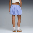 Lavender balloon mini skirt with elastic waistband and subtle Puma logo detail, combining playful volume with sporty aesthetics — λιλά φούστα balloon σε mini μήκος με ελαστική μέση και athletic χαρακτήρα, ιδανική για sporty chic και athleisure summer looks με statement διάθεση. Διαθέσιμη στο Iconic Angels Glyfada.