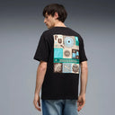 Black graphic t-shirt with front logo detail and bold multicolor Puma artwork on the back, combining streetwear aesthetics with relaxed fit comfort — μαύρο ανδρικό t-shirt με logo print μπροστά και statement πολύχρωμο graphic στην πλάτη, ιδανικό για street style και casual everyday looks με urban χαρακτήρα. Διαθέσιμο στο Iconic Angels Glyfada.