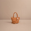 Χειροποίητη MANEBI small raffia mini tote bag in peach with top handles and detachable strap, γυναικεία ψάθινη mini τσάντα σε φυσική ροδακινί, από το Iconic Angels Glyfada.