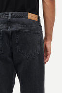 Samsoe Samsoe Black washed regular fit jeans with subtle fading and classic five-pocket design, offering a clean modern silhouette for versatile styling — μαύρο αντρικό washed jean παντελόνι regular fit με διακριτικά ξεβάμματα και mid-rise γραμμή, ιδανικό για smart casual και everyday looks με minimal αισθητική. Διαθέσιμο στο Iconic Angels Glyfada.