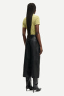 Light olive textured polo top with short sleeves, button placket and fitted silhouette, offering a refined casual feel — λαχανί κοντομάνικο polo top με κουμπιά και ελαστική textured ύφανση, σε εφαρμοστή γραμμή ιδανική για chic casual και modern everyday looks. Διαθέσιμο στο Iconic Angels Glyfada.